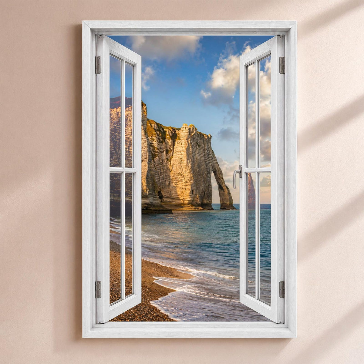 Trompe-l'œil sur Étretat : la falaise et son arche au-dessus de la plage de galets, par une fenêtre blanche ouverte, sur toile canvas tendue ou plexiglas, livré chez vous (exemple)